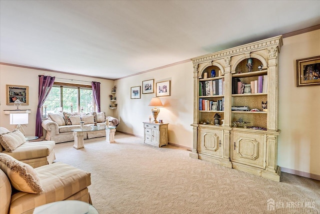 living room with ornamental molding, light colored carpet, and baseboards