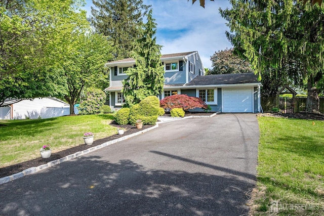 traditional-style house with driveway and a garage
