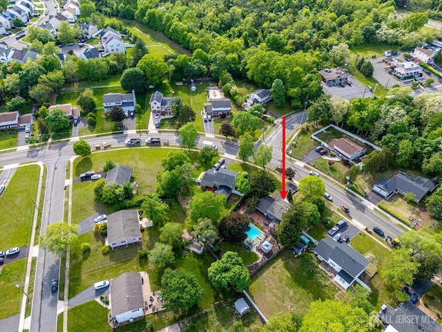 aerial view of property's location with nearby suburban area