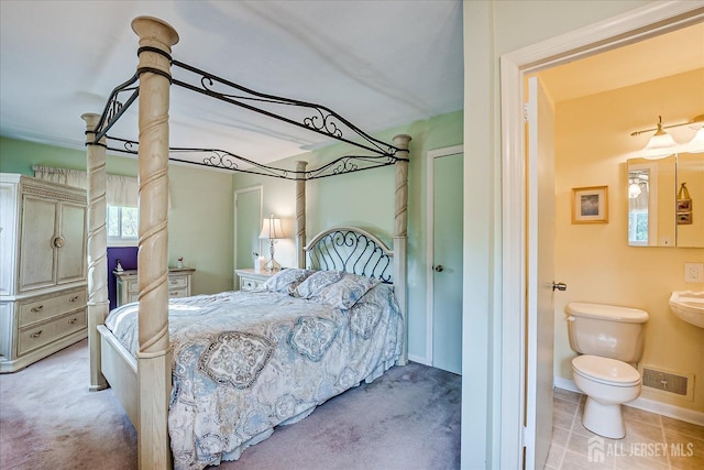 bedroom featuring baseboards and carpet flooring
