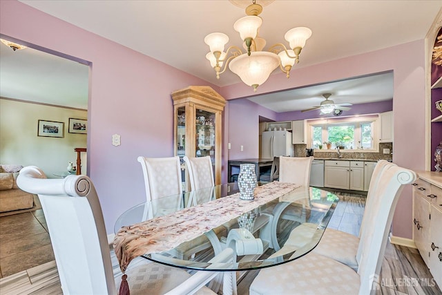 dining space featuring a chandelier and ceiling fan