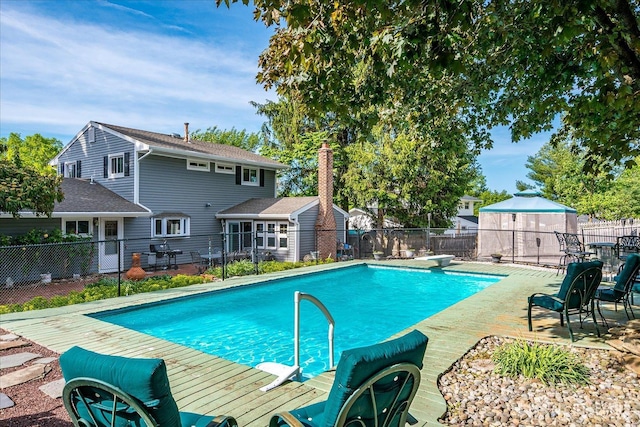 view of swimming pool featuring a fenced backyard and a patio