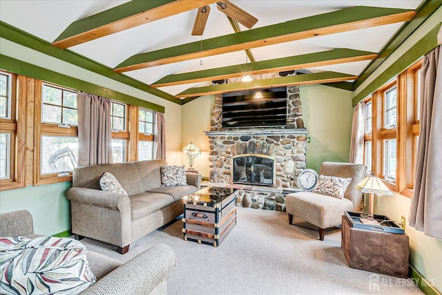 living room with carpet flooring, a stone fireplace, and ceiling fan