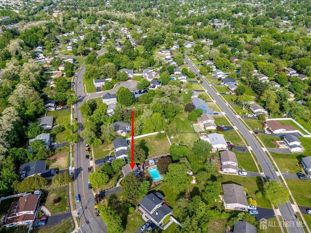 aerial view of property's location with nearby suburban area