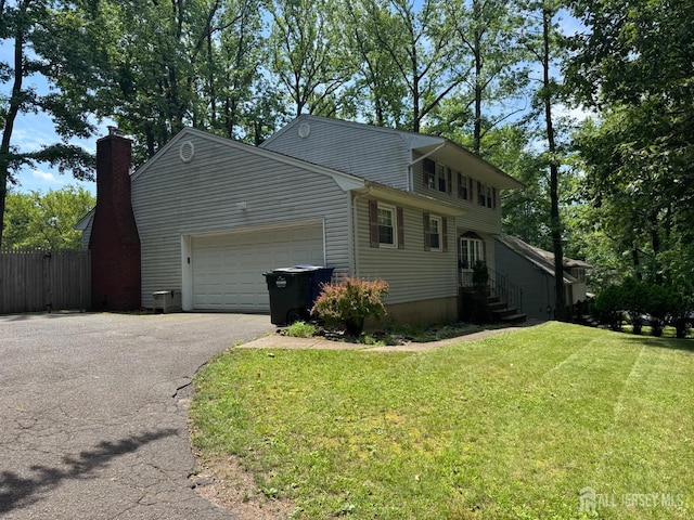 32 Gere Pl, Fanwood, NJ 07023 - view of home's exterior with driveway, a garage, and a chimney