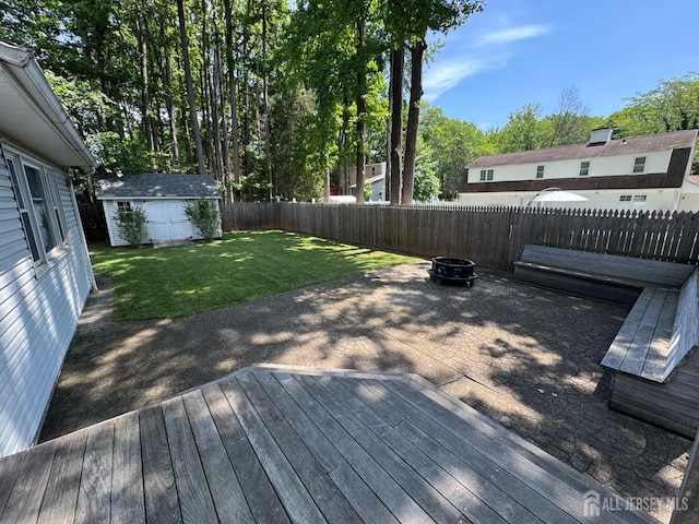 32 Gere Pl, Fanwood, NJ 07023 - wooden deck with an outdoor fire pit, a fenced backyard, and an outbuilding