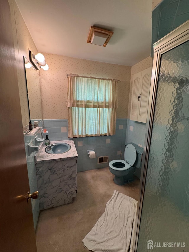 32 Gere Pl, Fanwood, NJ 07023 - bathroom with tile walls, vanity, a stall shower, a wainscoted wall, and wallpapered walls