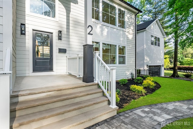 2 Beech Ln, Edison, NJ 08820 - entrance to property featuring a lawn and a garage