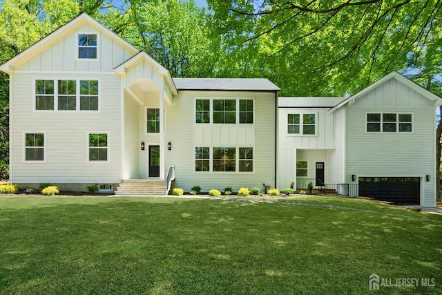 2 Beech Ln, Edison, NJ 08820 - modern farmhouse style home featuring board and batten siding, a front lawn, and a garage