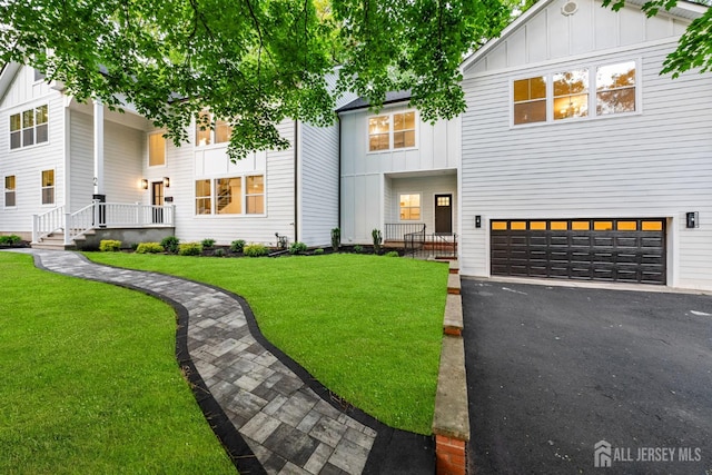 2 Beech Ln, Edison, NJ 08820 - multi unit property with board and batten siding, a garage, and driveway