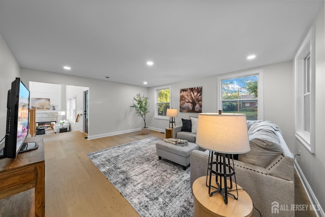 2 Beech Ln, Edison, NJ 08820 - living room featuring wood finished floors, recessed lighting, a fireplace, and baseboards