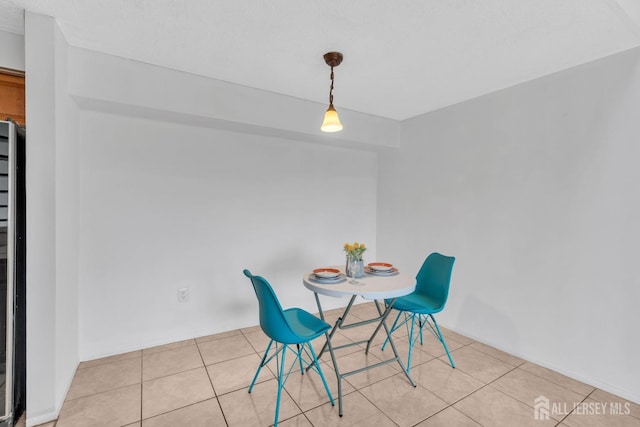 dining area with light tile patterned flooring