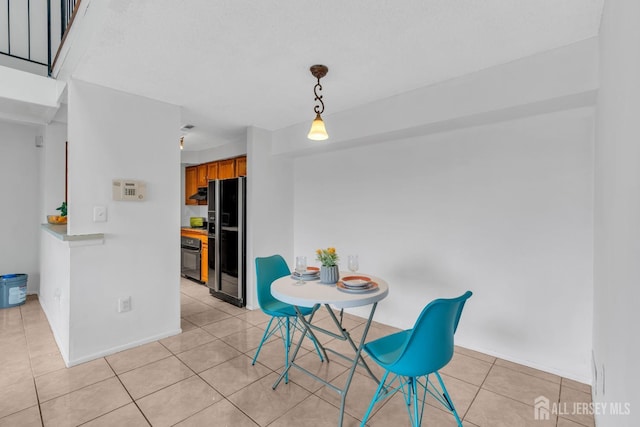 dining area featuring light tile patterned floors