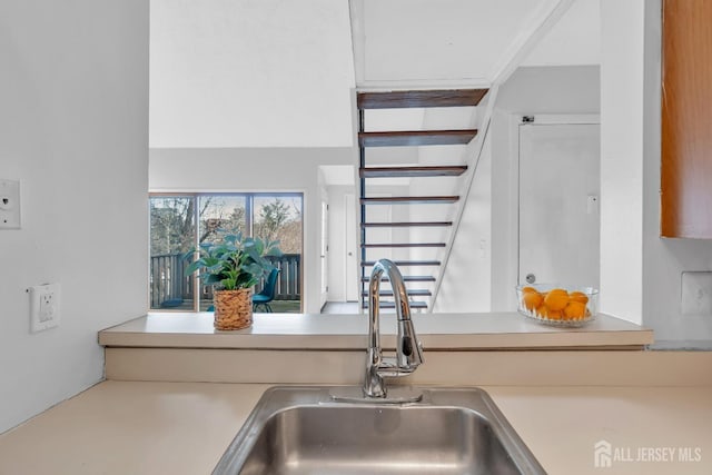 kitchen with light countertops and a sink