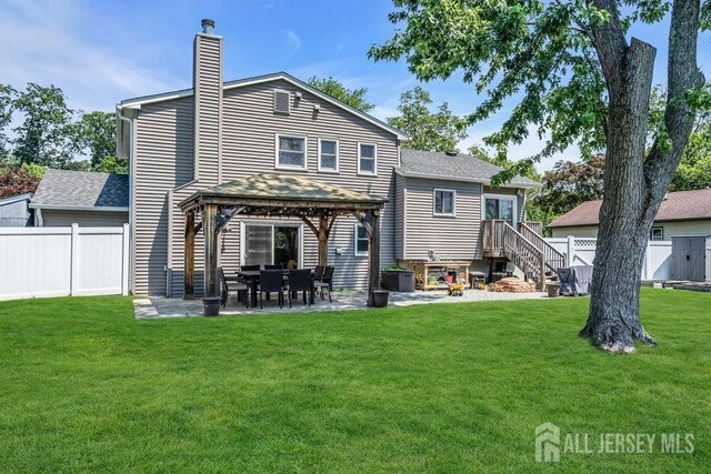 14 Academic Rd, East Brunswick, NJ 08816 - back of property featuring a chimney, a gazebo, roof with shingles, and a patio area