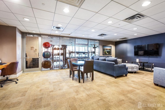 carpeted living area featuring recessed lighting, visible vents, and baseboards