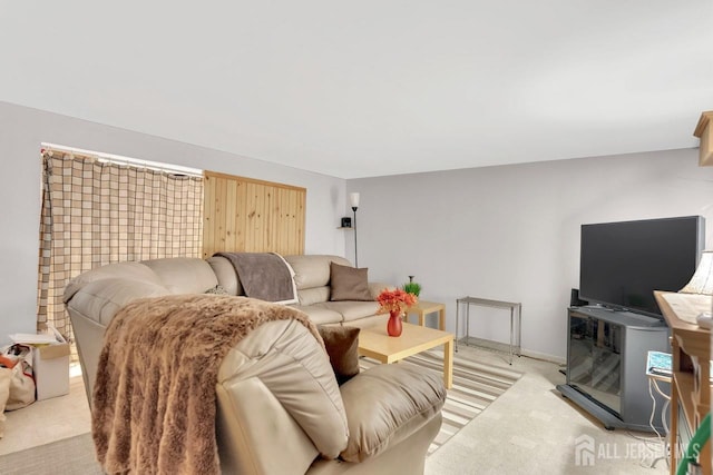 living room featuring light carpet