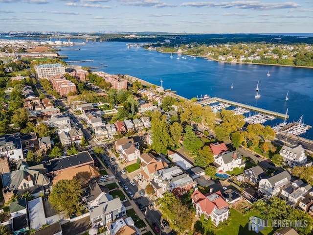 birds eye view of property featuring a water view