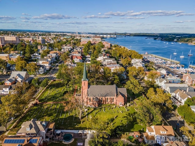 bird's eye view featuring a water view and a residential view