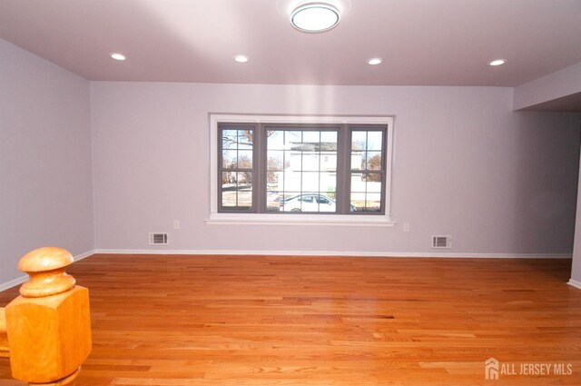 spare room with light hardwood / wood-style floors