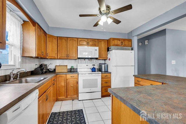 557 Howard Ave, Middlesex, NJ 08846 - kitchen featuring white appliances, dark countertops, ceiling fan, brown cabinets, and light tile patterned floors