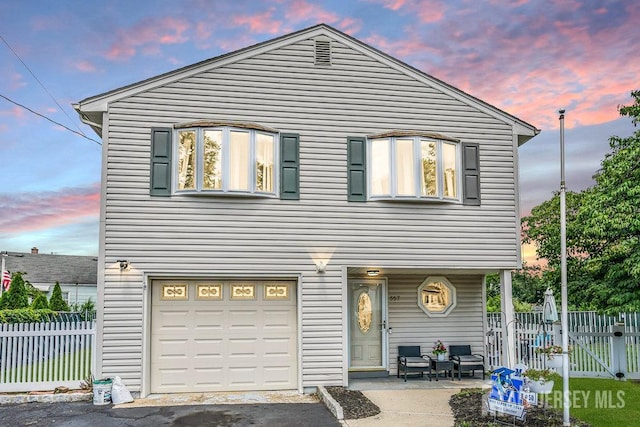 557 Howard Ave, Middlesex, NJ 08846 - view of front of house with a garage