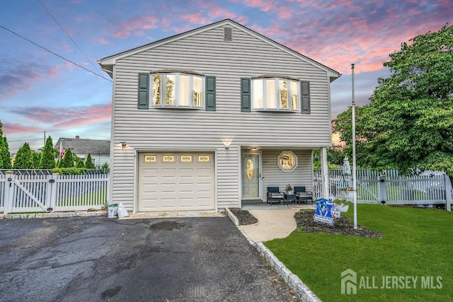 557 Howard Ave, Middlesex, NJ 08846 - traditional-style home featuring a gate, driveway, and an attached garage