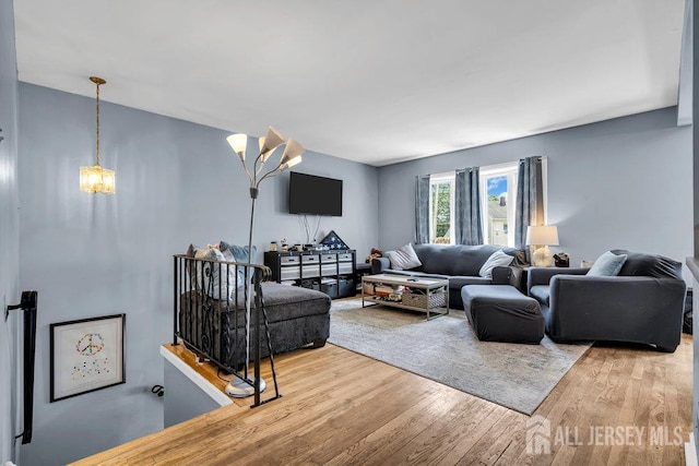 557 Howard Ave, Middlesex, NJ 08846 - living room with wood finished floors and a chandelier