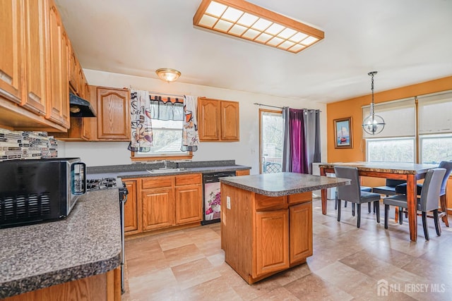 220 Raritan St, South Amboy, NJ 08879 - kitchen with dishwashing machine, a center island, and dark countertops