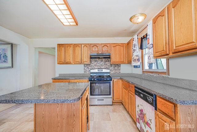 220 Raritan St, South Amboy, NJ 08879 - kitchen featuring stainless steel appliances, under cabinet range hood, a kitchen island, backsplash, and dark stone counters