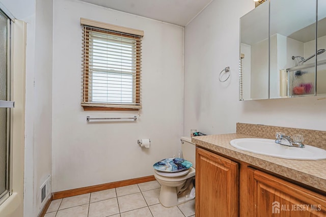 220 Raritan St, South Amboy, NJ 08879 - bathroom featuring a shower with shower door, vanity, and tile patterned flooring