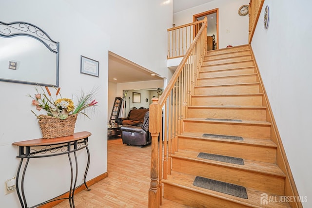 220 Raritan St, South Amboy, NJ 08879 - stairway with wood finished floors, recessed lighting, and a towering ceiling