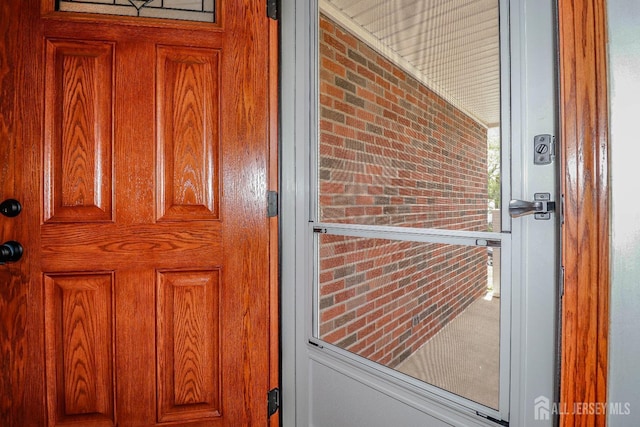 view of exterior entry with covered porch