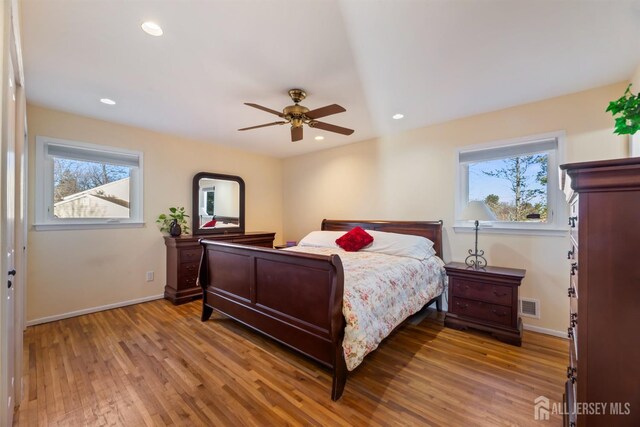 bedroom featuring ceiling fan and light wood-type flooring