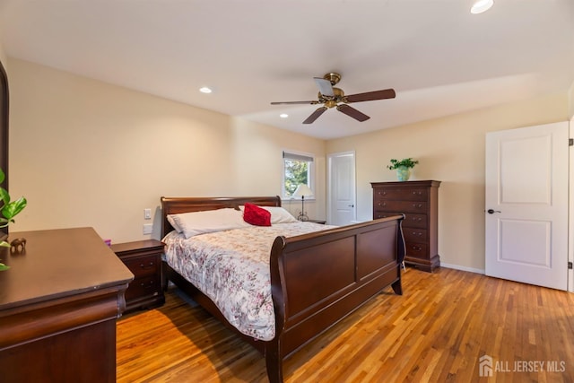 bedroom featuring light hardwood / wood-style flooring and ceiling fan