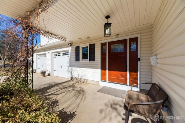 view of exterior entry featuring a garage