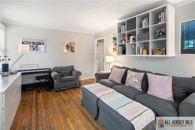 living room with wood-type flooring and crown molding