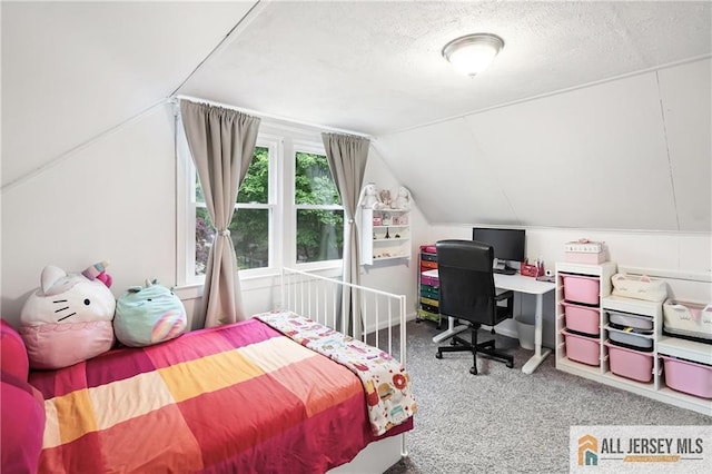 carpeted bedroom with lofted ceiling and a textured ceiling
