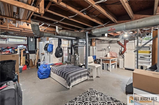 basement featuring washer / dryer and electric panel