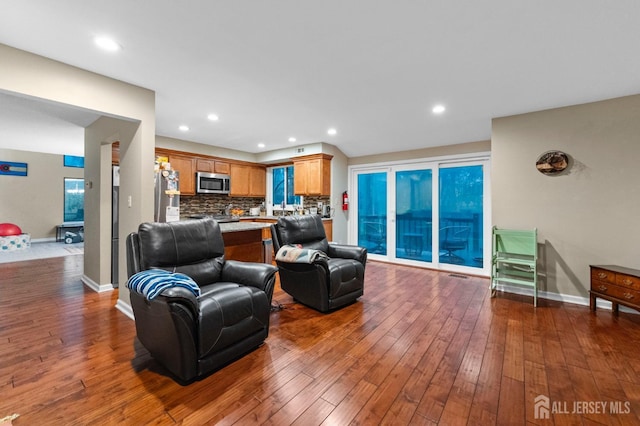 473 E Sayre Dr, Middlesex, NJ 08540 - living area with dark wood-style floors and recessed lighting