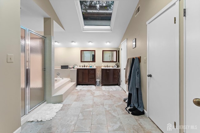 473 E Sayre Dr, Middlesex, NJ 08540 - full bath with vanity, a stall shower, a garden tub, and stone finish flooring