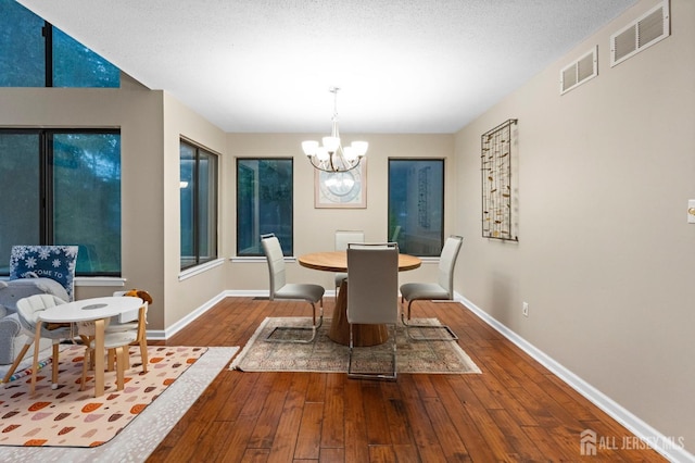 473 E Sayre Dr, Middlesex, NJ 08540 - dining area featuring a chandelier and wood-type flooring