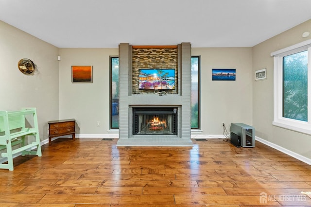 473 E Sayre Dr, Middlesex, NJ 08540 - living area with wood finished floors and a brick fireplace