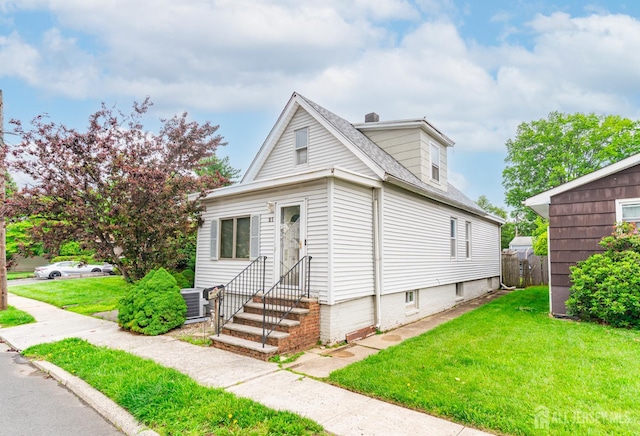 21 Suydam Ave, Edison, NJ 08817 - view of front of house featuring a front yard, entry steps, and a shingled roof