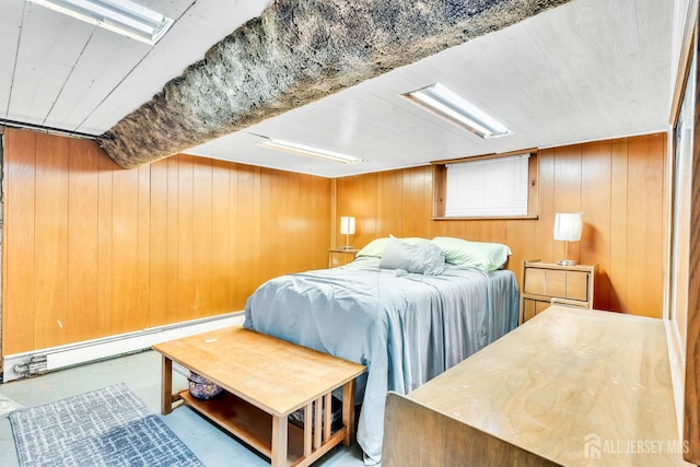 21 Suydam Ave, Edison, NJ 08817 - bedroom with concrete flooring, wood walls, and a baseboard heating unit