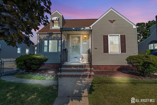 view of front of property with a yard