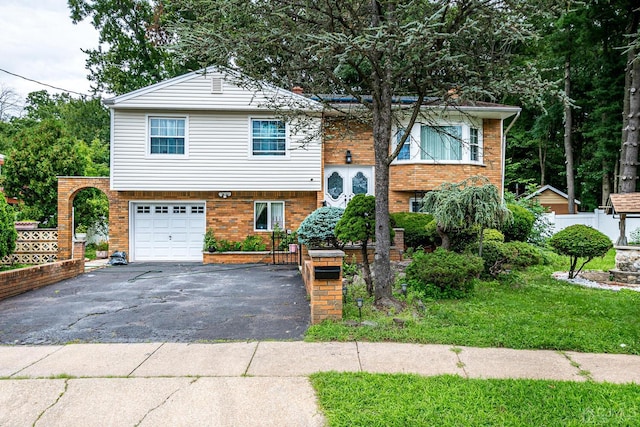 raised ranch featuring a garage