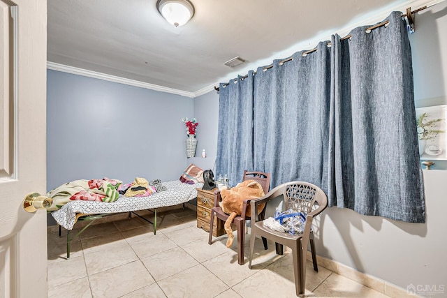 tiled bedroom featuring ornamental molding