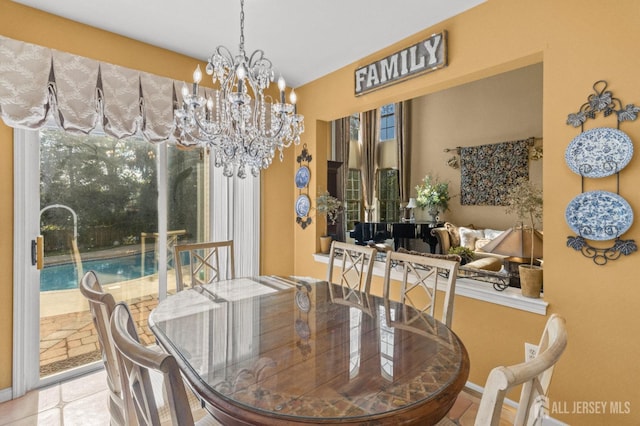 dining space featuring an inviting chandelier