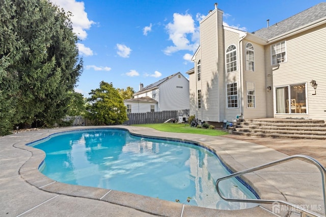 view of swimming pool with a fenced in pool, entry steps, fence private yard, and a patio